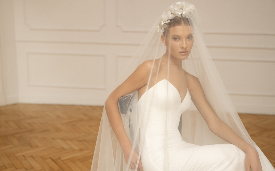 Bride choosing an unconventional head accessory to complement her look