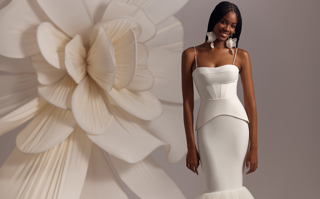Bride wearing minimalist accessories with sleek modern wedding dress 